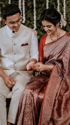 a man and woman sitting next to each other