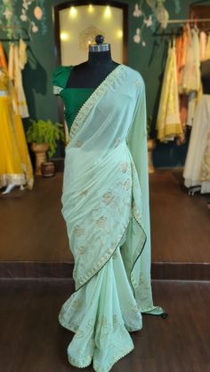 Beautiful green saree with sequin embroidery  saree fabric: Georgette  length:5.5 meters blouse: rawsilk Size: please choose a standard size from the drop down or you can choose custom measurements.  I'll send you a detailed measurements chart once you order. Green Dola Silk Pre-draped Saree With Dupatta, Green Embroidered Pre-draped Saree, Designer Chanderi Pre-draped Saree In Pista Green, Green Sharara With Traditional Drape In Tissue Silk, Green Tissue Silk Sharara With Traditional Drape, Green Tissue Silk Blouse With Dupatta, Green Chinon Pre-draped Saree For Navratri, Green Chanderi Pre-draped Saree For Reception, Green Tissue Silk Pre-draped Saree For Festive Occasions