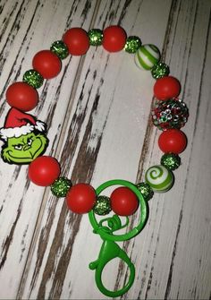 Handmade Grinch Wristlet made with Paracord that holds up Great! It does not stretch. Grinch Clay Bead Bracelets, Grinch Clay Bead Bracelet, Grinch Heishi Bracelets, Christmas Wristlets, Grinch Bead Keychain, Grinch Accessories, Christmas Bead Lanyard, Grinch Key Chains, Grinch