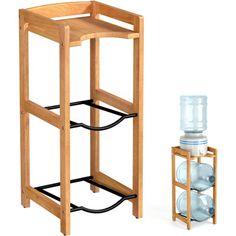 a wooden stand with two water bottles on it next to a plastic bottle holder that holds three glasses