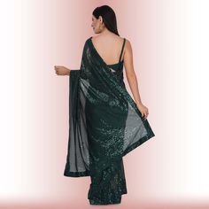 Introducing the exquisite "1 Minute Sequin Saree - Iridium"! ✨ Crafted from luxurious georgette, this saree combines timeless elegance with modern convenience. Designed for the busy fashionista, it comes pre-stitched for hassle-free draping. The dazzling iridium sequins glisten with every step, ensuring you steal the spotlight wherever you go. 💃Complementing this beauty is a classy spaghetti strap blouse that adds a touch of sophistication and allure to your ensemble. ✨Ideal for weddings, parti Glamorous Georgette Pre-draped Saree For Celebration, Green Cutdana Pre-draped Saree For Evening, Elegant Green Pre-draped Saree For Celebration, Glamorous Saree With Unstitched Blouse For Celebration, Glamorous Saree With Dupatta For Celebration, Glamorous Festive Saree For Celebration, Glamorous Pre-draped Saree For Celebration, Festive Glamorous Saree With Cutdana, Glamorous Festive Saree With Cutdana