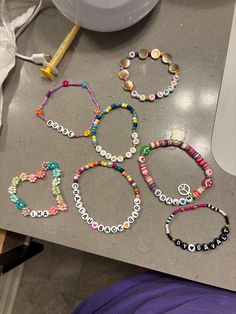 several bracelets are laid out on a table