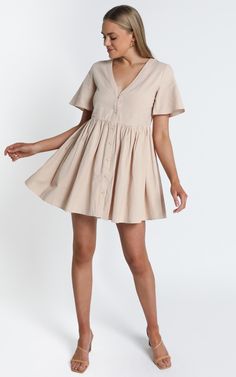 Staycation Dress In Beige | Showpo Casual Short Sleeve Flutter Dress For Summer, Casual Short Sleeve Dress With Flutter Sleeves For Summer, Casual Summer V-neck Dress With Buttons, Summer Short Sleeve V-neck Dress For Day Out, Summer V-neck Dress With Short Sleeves For Day Out, Summer Short Sleeve Mini Dress For Brunch, Summer Brunch Mini Length Short Sleeve Dress, Chic Short Sleeve Dress For Summer Vacation, Chic Short Sleeve Summer Vacation Dress