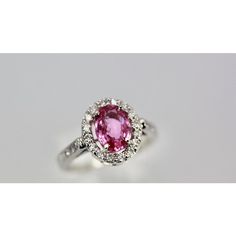 This is part of Chairish’s Fine Jewelry assortment.  Pink Sapphire and Diamond Ring  This Pink Sapphire and Diamond Ring is a gorgeous color of pink. Also, it is set with a Diamond Halo around the stone and Diamonds going down the shank.  This lovely ring is new and weighs 1.20 carats. It is a size 6.5 but can be re-sized no problem.  The color of this Sapphire is amazing true pink. Gia Certified Pink Sapphire Rings For Formal Occasions, Gia Certified Fine Jewelry Pink Sapphire Diamond Ring, Fine Jewelry Gia Certified Pink Sapphire Diamond Ring, Gia Certified Pink Sapphire Diamond Ring, Gia Certified Pink Sapphire Diamond Ring In Fine Jewelry, Formal Pink Diamond Ring In Platinum, Formal Pink Cluster Ring With Brilliant Cut, Classic Pink Diamond Cluster Ring, Gia Certified White Gold Pink Sapphire Jewelry