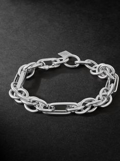 Classic jewellery often serves as a starting point for Lauren Rubinski, which she personalises and modernises through her unique design. This bracelet is cast from white gold using a variety of chain links, creating contrasting shapes and dimensions. It's understated enough to make your everyday signature. Modern Chunky Chain Link Bracelet, Modern Link Chain Bracelet With Chunky Chain, Elegant White Gold Bracelet With Chunky Chain, White Gold Chunky Link Chain Bracelet, White Gold Chunky Chain Link Bracelet, Modern Sterling Silver Bracelet With Chunky Chain, Elegant Silver Chunky Chain Bracelets, White Gold Link Chain Bracelet, Elegant Silver Bracelets With Chunky Chain