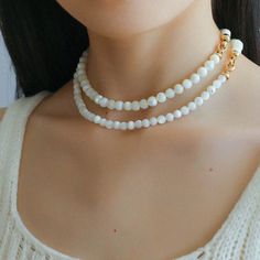 This elegant necklace showcases simplicity at its finest, featuring smooth white shell beads delicately strung together. The minimalist design exudes a timeless charm, perfect for both casual and formal occasions. With its versatile style, this necklace effortlessly complements any outfit, adding a touch of sophistication to your look. Metal: 18K Recycled Gold Plated On Brass Gemstone: Mother of Pearls(6.5mm/8mm/12mm) 6.5mm/8mm Bead Chain Length: 400mm 12mm Bead Chain Length: 390mm Weight: 26.5/ Round Bead Necklace, Edison Pearls, Elegant Necklace, Bead Chain, Tiger Eye Stone, Mother Pearl, Elegant Necklaces, Recycled Gold, Shell Beads