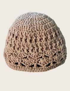 a crocheted hat is shown on a white background