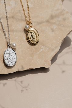 This non-tarnish sterling silver necklace is an updated look on a classic way to wear your faith. The Miraculous Medal Necklace is a beautiful visual reminder of our eternal mother. This elegant piece serves as a reminder in the power of faith filled prayer. Whether you are dressing up or dressing down this meaningful necklace is the perfect focal point of any outfit. Stats: Hypoallergenic Non- tarnish Waterproof Elegant Sterling Silver Necklace With Miraculous Medal, Sterling Silver Miraculous Medal Jewelry, Elegant Miraculous Medal Jewelry For Gift, Elegant Miraculous Medal Jewelry Gift, Spiritual Sterling Silver Necklace With Miraculous Medal, Elegant Miraculous Medal Necklace, White Gold Necklace With Miraculous Medal For Gift, White Gold Necklace With Miraculous Medal As Gift, Sterling Silver Miraculous Medal Necklace As Gift