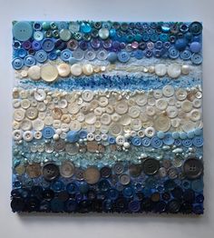 a painting made out of buttons on a wall