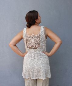 This beautiful knitted summer tunic tank top is soft and comfortable.  It is entirely hand knitted with a light summer yarn, 55% cotton, 40% acrylic and 5% polyamide. The Romanian needle  lace at the back, is in the exact same color as the tunic's yarn making it a perfect fit.  As the lace is vintage this top is a limited edition of 2, truly unique. If you want yours to be made in a different size, please let us know. The tunic is made of a natural breathing material, super comfortable. Size  me Esty Finds, Knitted Tunic, Summer Yarn, Bohemian Top, Amazing Finds, Summer Tunics, Cozy Crochet, Bohemian Tops, Handmade Lace