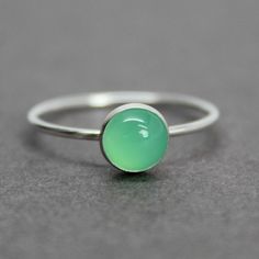 A dainty 6mm Chrysoprase ring just listed!  https://kathybankston.com/products/dainty-6mm-round-green-chrysoprase-ring-925-sterling-silver-size-7-us #chrysoprase #rings #Springgreen #dreamingofspring Adjustable Green Opal Ring, Green Sterling Silver Stackable Promise Rings, Green Stackable Birthstone Ring With Round Shape, Green Stackable Birthstone Ring Round, Dainty Green Emerald Ring With Bezel Setting, Green Stackable Round Birthstone Ring, Green Round Stackable Birthstone Ring, Green Sterling Silver Stackable Rings For May Birthstone, Green Sterling Silver Stackable Emerald Ring