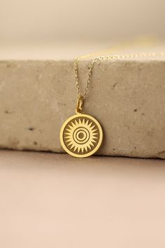 Gold Sun Pendant - Sun Gold Necklace ● Material of pendant: Solid Gold 14k ( REAL GOLD ) ● Metal Stamp: 14k ( REAL GOLD ) ● The pendant is available in 5 sizes: - 12,7 mm / 0.5 inches (Diameter) - 14,0 mm / 0,55 inches ( Diameter ) In the photos - 15,3 mm / 0.6 inches ( Diameter ) - 16,5 mm / 0,65 inches ( Diameter ) - 19,1 mm / 0,75 inches ( Diameter ) ( In the photos the size is 14mm / 0.55 inches Diameter ) ( Jump Ring inner diameter: 4 mm ) ● Material of chain: Solid gold 14k ( REAL GOLD ) I 14k Gold Amulet Charm Necklace With Round Pendant, Yellow Gold Medallion Jewelry As A Gift For Her, Spiritual 14k Gold-filled Yellow Gold Charm Necklace, Spiritual 14k Gold Filled Yellow Gold Charm Necklaces, Yellow Gold Plated Round Charm Necklace, Tarnish Resistant Yellow Gold Charm Necklace For Her, 14k Gold Engraved Amulet Charm Necklace, 14k Stamped Amulet Style Round Pendant Necklace, Spiritual Yellow Gold Charm Necklace For Her