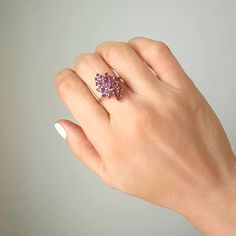 This vintage piece features a beautiful Marquise shaped Amethyst cluster set in 14K Yellow Gold. The Amethyst stones make up approximately 1 carat total weight and the ring weighs 4 grams. An eye-catching and timeless addition to any jewelry collection. Size 7 sizing available with fee contact us to have it added to the price before checkout.Thank you for visiting our shop!Visit our website DmKJewelry.comAlso Follow us on Instagram https://www.instagram.com/dmkjewelryny/ Amethyst Stones, Amethyst Cluster, The Ring, Amethyst Stone, Cluster Ring, 1 Carat, Vintage Rings, Jewelry Collection, Amethyst