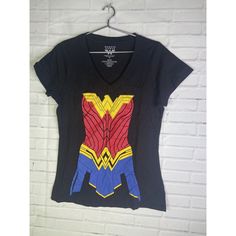 Up For Grabs Is A Brand New Without Tag Dc Comics Wonder Woman Graphic Print V-Neck Short Sleeve Tee T-Shirt Women's Juniors Size Large. Never Worn Or Used. Measurements Laying Flat Are Included In Photos, Please Compare Them To Your Own For Proper Fit! Please Refer To All Photos. Ask Any Questions Prior To Purchasing. Thanks! Short Sleeve Tops With Front Print For Fan Conventions, Fan Apparel Tops With Character Print For Conventions, Black Tops With Screen Print For Fan Conventions, Pop Culture Tops With Cartoon Print For Cosplay, Black Tops For Comic-con Fan Conventions, Fitted Black Tops With Character Print, Black Screen Print Tops For Fan Conventions, Fandom Graphic Print Tops For Fan Conventions, Fan Apparel Tops With Graphic Design For Conventions