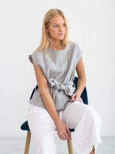 "ALEXANDRA is a linen tie waist top. DETAILS - Cap sleeve design - Crew neck - Self tie belt - 100% lightweight European linen fabric - Cut and sewn to order just for you in our studio COLOR - Stripe, you can also choose other colors above - Fabric samples are available here https://www.etsy.com/listing/586569696/linen-fabric-samples SIZING & FIT - Relaxed, loose fit - Length (shoulder to hem) is approximately 22.5 inches / 57 cm - Bust (pit to pit) is approximately 20.5 inches / 52 cm - Sho Summer Linen Top With Tie Waist, Linen Tie Waist Top For Summer, Summer Linen Tops With Tie Waist, Chic Summer Top With Tie Fastening, Chic Summer Tops With Tie Fastening, Spring Tops With Tie Waist For Day Out, Spring Tie Waist Top For Day Out, Beach Linen Tops With Tie Waist, Casual Tied Top For Spring