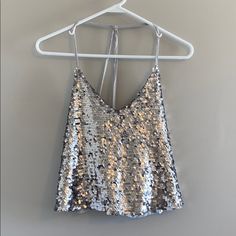 Nwt Silver Sequined Crop Tank Armpit To Armpit: 17” Shoulder To Hem: 19.5” Pet And Smoke Free Home All Measurements Are Approximate Silver Fitted Tank Top For Party Season, Silver Fitted Tank Top For Party, Fitted Silver Tank Top For Summer, Silver Tank Top For Spring Party, Silver Tank Top For Summer Party, Silver Sleeveless Crop Top For Night Out, Chic Silver Sequined Tops, Silver Crop Top For Party Season, Glamorous Silver Tank Top For Party