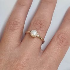 Engagement Gold ring, 14k Gold ring, Gold ring with pearl, ivory pearl gold ring, bridal pearl ring, bridesmaid gift This Shell handmade Gold ring with Pearl is made of 14K genuine gold and set with Natural Pearl. This Stunning Ring is set with Best AAA+ Quality Natural Pearl set in 14k Yellow Gold. High end finish with easy touch of diamond cut. This 14k Gold ring can serve as an engagement ring or a birthday gift. All colors at the picture are available. * Gemstone -6mm Round Natural Pearl. * Minimalist Pearl Drop Ring For Wedding, Minimalist Wedding Pearl Ring With Pearl Drop, Elegant Pearl Wedding Ring, Pearl Open Ring For Wedding, Open Pearl Ring For Wedding, Anniversary Pearl Rings In Fine Jewelry Style, Fine Pearl Rings For Anniversary, White Gold Pearl Ring For Wedding, Minimalist Pearl Drop Ring For Anniversary