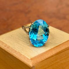 Estate/ vintage 10KT yellow gold oval-cut, genuine, blue topaz ring. Stunning blue color! Blue Topaz is the birthstone for December babies- and this piece makes a spectacular gift! Size 7.5 Can be resized for an additional fee Weight: 5.8 grams Topaz measures: 18mm x 13mm Genuine, oval-cut, checkerboard, faceted blue topaz Stamped 10KT Excellent estate condition Blue Oval Birthstone Ring In Fine Jewelry Style, Oval Blue Birthstone Ring, Oval Blue Topaz Ring With Accent Stones, Formal Oval Blue Topaz Birthstone Ring, Oval Blue Topaz Ring In Fine Jewelry Style, Fine Jewelry Oval Blue Topaz Ring, Oval Blue Topaz Ring Fine Jewelry, Oval Blue Birthstone Ring Gift, Oval Blue Birthstone Ring As A Gift