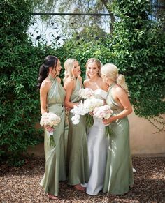 the bridesmaids are all dressed in green dresses