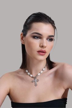 💎 Elevate your look with our Zircon and Pearl Cross Necklace, a stunning piece that combines sparkling zircon stones with the timeless beauty of pearls. This show-stopping pendant is perfect for those who love bold, elegant jewelry that makes a statement. Whether you're dressing up for a special event or adding a touch of glamour to your daily look, this cross necklace is sure to shine! ✨ At LuxoticaBoutique, we bring together cool, modern designs with classic sophistication. Each piece is craf Elegant Silver Cross Pearl Necklace, Silver Cross Pearl Pendant Necklace, Silver Cross Jewelry With Pearl Chain, Silver Pearl Cross Pendant Necklace, Silver Pearl Necklace With Cross Pendant, Elegant Cross-shaped Pearl Pendant Necklace, White Crystal Jewelry With Pearl Charm, Elegant Cross Necklace With Pearl Pendant, Silver Cross Necklace With Pearl Drop