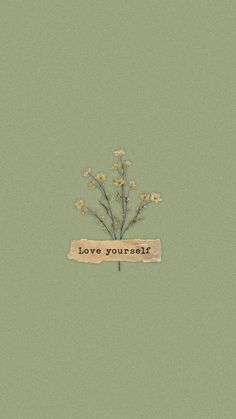 the words love yourself are written on a piece of paper with flowers growing out of it