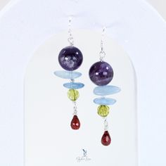 amethyst beaded multi gemstone earrings Unique Dangle Earrings With Gemstone Beads, Purple Gemstone Bead Dangle Earrings, Purple Gemstone Beads Dangle Earrings, Blue Amethyst Dangle Earrings, Purple Dangle Earrings With Gemstone Beads, Unique Amethyst Earrings With Natural Stones, Amethyst Multi-stone Drop Earrings, Peridot Gemstone Dangle Jewelry, Peridot Gemstone Drop Earrings