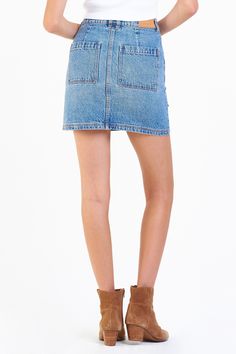 Super high rise skirt in classic denim. It's the stable fit that sits at waist and fitted easy in the hip and thigh. Skirt inseam on rigid denim (non-stretch) accented with asymmetrical front yoke & pocket details, back darts for lift support, double button waistband closure.17" Front Length; include waistband, 17 1/2" Back Length; include waistband (Size 27) 71% COTTON 29% LYOCELL Machine wash cold, Tumble dry low Imported Zip fly and button closure Patch front & back pocket Fitted Medium Wash Skort With Frayed Hem, Fitted High Waist Medium Wash Skort, Mid-rise Fitted Skort In Medium Wash, High Waist Medium Wash Cotton Skort, Medium Wash Denim Skort, Mid-rise Fitted Medium Wash Skort, Medium Wash Mid-rise Fitted Skort, Fitted High Rise Denim Skort, High Waist Medium Wash Skort For Spring