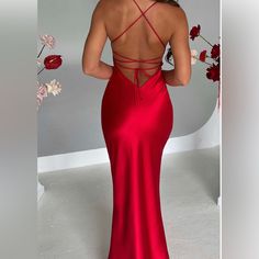 Red Tie Back Maxi Dress For Party, Red Tie-back Maxi Dress For Party, Red Carpet Satin Maxi Dress, Fitted Red Satin Maxi Dress, Elegant Backless Red Carpet Gown, Red Tie Back Dress For Formal Occasions, Red Backless Formal Gown, Red Tie Back Dress For Evening, Red Tie-back Dress For Evening