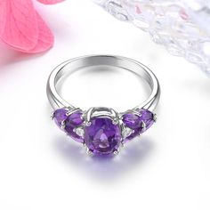 Elegant Vintage 2.5 Carat Natural Amethyst and Silver Ring with Classic Design This sterling silver ring embodies a luxurious and classic style, featuring a stunning deep purple 2.5 carat natural Amethyst gemstone, reminiscent of vintage elegance. Timeless Craftsmanship Crafted with precision and sophistication, this ring is a perfect addition to any jewelry collection. Its vintage design makes it suitable for various occasions, from casual outings to formal events. Gemstone Quality Metal: 925 S Classic Elegant Style, Wedding Band Styles, Purple Gems, Healing Crystal Jewelry, Vintage Elegance, Classic Elegant, Fine Rings, Amethyst Gemstone, Classic Vintage