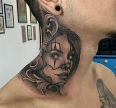 a man with a tattoo on his neck