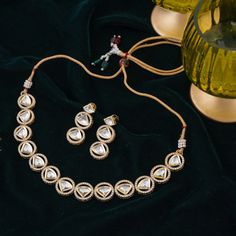 Step-in to the aura of timeless elegance with this must-have piece adding a touch of class to any ensemble! Embellish your look with subtle sophistication and enhance your style with this exquisite set crafted with luxurious and dazzling polki jadau kundan stones. The set includes a necklace and a pair of push-back earrings. Approximate earrings length is 1.5". Gold-plated on high-quality brass as base metal. In-stock & ready-to-ship. *Please Note: We use faux stones and beads in all of our jewe Unique Gift Cards, Create Words, Faux Stone, Touch Of Class, A Necklace, Base Metal, Beautiful Jewelry, Timeless Elegance, Aura