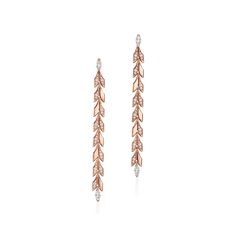 Inspired by the natural world, Tiffany Victoria designs capture the fluid movement of flowers, vines and leaves with a mix of expertly cut diamonds. These long drop vine earrings are crafted of 18k rose gold that features a contrast of high polish and sandblasted finishes. Round brilliant and marquise diamonds totaling nearly one carat play off the light and accentuate the vine motif. When too many diamonds are never enough, Tiffany Victoria is the ultimate way to shine. For maximum impact, wear these long drop earrings on their own. 18k rose gold with round brilliant and marquise diamonds; 2.91” long; Carat total weight .99 | Tiffany Victoria® Vine Drop Earrings in Rose Gold with Diamonds Tiffany Victoria, Vine Earrings, Tiffany Earrings, T Design, Golden Disk Awards, International Jewelry, Love Earrings, Gold Jewelry Earrings, Long Drop Earrings