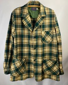 "1970s - 1980s Pendleton Three-Pocket Plaid Shacket... Shades of green, tan, brown, and white. Good shape, but not perfect-- a few pin holes and slight stains... please see pictures. Size: M Length (top of collar to bottom): 31\" Width (pit to pit): 22\" N O T E || As with most vintage items, they will have signs of wear. We do our best to note any noticeable flaws either in the descriptions or the photos. Please message us with any questions about the conditions of items before purchasing. All Green Collared Outerwear With Patch Pockets, Green Collared Outerwear With Welt Pockets, Green Top With Patch Pockets For Fall, Green Long Sleeve Tops With Patch Pockets, Green Fall Tops With Flap Pockets, Green Tops With Flap Pockets For Fall, Green Top With Lapel Collar And Pockets, Green Tops With Lapel Collar And Pockets, Green Tops With Pockets And Lapel Collar