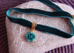 "Velvet choker pendant - Green emerald necklace rose - Polymer clay flower jewelry for women Velvet dark green ribbon choker with sculpted emerald rose. Rose material is polymer clay with special cover. Each petal of flower made by hand Dia flower about 15 mm/ 0.55 \" Length of choker is adjustable: 10-12 inches/ 25,4 - 30,5 cm 11-13 inches/ 28-33 cm 12-14 inches/ 30.5- 35.5 cm 13-15 inches/ 33-38 cm 14-16 inches/ 35.5 cm-40.6 cm 15-17 inches/ 38,1 cm- 43,2 cm 16-18 inches/ 40,6 cm- 45,7 cm 17-1 Elegant Rose Design Jewelry Choker, Elegant Rose Design Choker Jewelry, Adjustable Flower Pendant Choker For Gift, Adjustable Flower Pendant Choker Gift, Gift Flower Pendant Adjustable Choker, Elegant Rose Design Choker As Gift, Green Jewelry Gift With Rose Design, Green Jewelry With Rose Design For Gift, Rose Design Choker Jewelry Gift