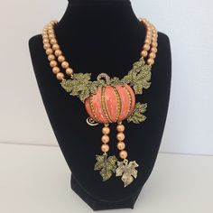 Retired Heidi Daus Necklace Pumping  Orange Enamel with Green Crystals and Goldtone Pearls. Stunning massive necklace with beautiful details and intricate design.   Bronze Metal frame, Crystal orange, pink, green, goldtone beads. Luxurious necklace signed Heidi Daus. In pristine pre-owned condition.  Please note, the size of the bust is smaller than average, and the necklace position on the body might differ from how it's pictured. For new arrivals check out the store's Instagram account https:/ Pink Pendant Necklace With Jewels, Luxury Pink Jeweled Jewelry, Handmade Pink Necklace For Formal Occasions, Exquisite Pink Necklace For Gift, Luxury Handmade Pink Jewelry, Formal Pink Handmade Necklace, Luxury Handmade Orange Jewelry, Unique Rose Gold Round Necklace, Elegant Jeweled Pink Necklace