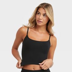 YOUR NEW CAMI GO-TO Fresh. Modern. Confident. You are going to love the versatility of this cami. The Seamless Smoothing Cropped Cami provides the extra boost you need with body-hugging styles. Seamless and lightweight, this women’s bodywear cami is crafted from a single-layer fabric for light smoothing. A built-in shelf bra offers support while the modern cropped length has a ribbed hem that lightly embraces your midsection. Perfect for layering, this versatile cropped cami features adjustable Black Seamless Tank Top For Yoga, Yoga Tops With Seamless Design And Tank Straps, Casual Black Seamless Camisole, Black Spaghetti Strap Crop Top For Workout, Black Seamless Spaghetti Strap Tops, Black Seamless Medium Support Tank Top, Seamless Cami Top For Workout, Black Seamless Cami Tank Top, Black Yoga Top With Medium Bust Support