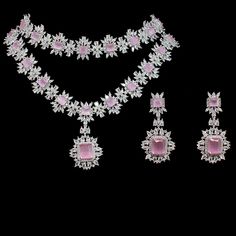 For edgy style and sophisticated sparkle, this necklace set is a dream come true! Elegant and shimmering set with CZ and pink stones creating a flawlessly fresh finish for each and every one of your evening ensembles. The set includes a choker paired with a necklace and a pair of beautiful earrings. Approximate earrings length is 2.1". Silver-plated on high-quality brass as base metal. Made by order. Kindly allow 5-7 weeks for the delivery of this item. For custom or urgent requests, please cont Luxury Pink Cutdana Jewelry, Pink Crystal Jewelry With Jewels, Party Jewelry Sets With Stones, Pink Jeweled Jewelry For Formal Occasions, Luxury Pink Crystal Jewelry, Formal Pink Jeweled Jewelry, Pink Jewelry With Diamond Accents For Evening, Pink Jewelry Sets With Sparkling Stones For Wedding, Pink Diamond Jewelry For Evening