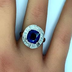 A superb richly colored sapphire takes center stage of this platinum diamond ring. The sapphire weighs just under 4 carats, (3.98), and has a rich vivid blue color known in the trade as “royal blue” for the finest of sapphires. The GRS lab in Switzerland has given this stone the color grade of royal blue for its top gem quality color. Additionally, it has a Ceylon (Sri Lanka) origin which is the most classic source of blue sapphire. It is surrounded by 1.60 carats of baguette-cut diamonds which Ceylon Sapphire, Platinum Diamond Rings, Baguette Cut Diamond, Platinum Ring, Sapphire Diamond, Royal Blue, Blue Sapphire, Platinum, Diamond Ring