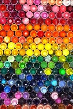 many different colored paints are arranged in rows