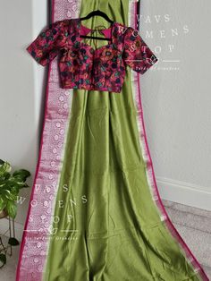 Blouse stitched - Yes Blouse Opening - Back Sleeves Length - Elbow Padded - No Blouse size - 34 with inner margins expandable upto 40 For Blouse Size 32 alteration can be done on request. Fall/Pico - Yes Done Green Raw Silk Blouse For Navratri, Green Chanderi Blouse With Zari Weaving, Green Banarasi Silk Blouse With Zari Weaving, Green Zari Weaving Blouse In Art Silk, Green Art Silk Blouse With Zari Weaving, Green Zari Weaving Art Silk Blouse, Green Blouse With Zari Weaving For Navratri, Green Banarasi Silk Blouse For Navratri, Green Zari Weaving Blouse For Navratri