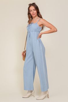 THE PERFECT MIX OF FLIRTY AND FUN, THIS JUMPSUIT IS READY FOR ANY SUMMER OCCASIONS. THE FLOWY SILHOUETTE IS COMPLEMENTED BY A SQUARE NECK LINE, RUCHED BUST, AND FRONT KEYHOLE DETAILS. WHETHER YOU ARE SIPPING COCKTAILS OR DANCING THE NIGHT AWAY, THIS DENIM BLUE JUMPSUIT WILL HAVE YOU FEELING THE BEST.* SLEEVELESS DESIGN* SPAGHETTI STRAP* SELF FRONT TIE* FRONT KEY HOLE* LIGHTWEIGHT MATERIAL* THE MODEL IS 5'9" AND WEARING SIZE SMALLMade In: ChinaFabric Contents: 90% cotton 10% viscoseSize Measureme Summer Bottoms, Jumpsuit Fitted, Blue Jumpsuit, Jumpsuit Summer, Blue Jumpsuits, Sleeveless Jumpsuits, Denim Jumpsuit, Light Denim, Sheer Fabrics