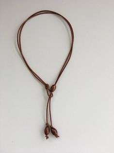 Brown Pearl Leather Lariat Necklace - Etsy Adjustable Brown Necklace With Waxed Cord, Casual Brown Necklace With Adjustable Cord, Adjustable Brown Waxed Cord Necklace, Brown Resizable Waxed Cord Jewelry, Resizable Brown Waxed Cord Jewelry, Brown Lariat Jewelry With Adjustable Cord, Adjustable Brown Lariat Necklaces, Adjustable Brown Lariat Necklace, Brown Adjustable Lariat Necklace