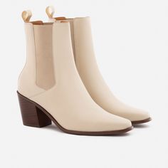 A unique Chelsea boot. Inspired by cowboy boots and western styling, the Bianca Chelsea Boots kick things up a few notches. The semi square toe box, alluring Cuban heel and sculptural shape create a captivating silhouette that will attract the right kind of attention. With a contemporary look and feel, the Biancas love to have fun, and play well with your casual outfits and dressy ensembles. Go ahead, take them for a whirl. This product is made from Gold Rated full-grain calfskin leather sourced Western Boots With Stacked High Heel, Western Boots With Sculpted Heel For Fall, Western High Heeled Boots With Reinforced Heel, Beige Western Boots With Square Toe, Chic Fitted Chelsea Boots With Square Toe, Western Mid-calf Boots With Square Toe And Stacked Heel, Western Boots With Block Heel, Western Mid-calf Boots With Stacked Heel And Square Toe, Western Mid-calf Boots With Square Toe And Reinforced Heel