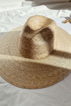 Lack of color Palma Wide Fedora is handmade by artisans in Mexico, our new 100% baked palm leaf hats are perfect for the Summer soiree of your choice. Featuring a cowboy crown and tightly woven pressed palm, this hat is made for Summer. Natural Palm Leaf wide-brimmed western hat 100% Palm Leaf in Natural Inner elastic sweatband to help with fitBrim measures approx. 12 cm / 4.7” Sits higher on head Spot / specialist clean This hat is accredited with a UPF Rating 50+ (Australian Tested) Please note, hat features including straw color and brim width may vary slightly from piece to piece. These hats are individually handcrafted by artisans, each with its own unique character. We want your new hat to be as unique as the person wearing it and consider this a contribution to the unique character Handmade Natural Straw Hat For Rodeo, Handmade Natural Color Sun Hat For Rodeo, Handmade Natural Sun Hat For Rodeo, Handmade Natural Sun Hat For Country Events, Summer Rodeo Hats Handwoven, Natural Fedora Hat For Festivals, Natural Color Fedora Hat For Festivals, Festival Natural Color Fedora Hat, Handmade Wide Brim Panama Hat In Toquilla Straw