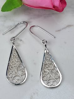 Filigree earrings made by intricate metal work, creating a dainty look. The Boho 925 earrings are inspired by Boho jewelry combined with modern design. These sterling silver long earrings are perfect for a beloved woman, and as a pampering gift for yourself. The earrings are very flattering, comfortable to wear as a jewel for everyday use and impressive as a jewel for a special occasion. The structure of the earrings is  approximately 25 mm long, creating an elegant and unique style. The earrings are made of 925 sterling silver by hand tools only. Each piece of jewelry is handmade to order, therefor due to the special nature of handcrafting, there may be slight differences compared to the jewelry in the photos shown. This adds to the charm and individuality of each piece, making it truly o Filigree Jewelry Design, Silver Filigree Jewelry, Silver Filigree Teardrop Earrings For Wedding, Sterling Silver Teardrop Earrings With Intricate Design, Sterling Silver Intricate Teardrop Earrings, Elegant Sterling Silver Nickel-free Teardrop Earrings, Elegant Nickel-free Sterling Silver Teardrop Earrings, Elegant Silver Teardrop Earrings In Sterling Silver, Elegant Silver Teardrop Sterling Silver Earrings