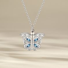 This photo necklace is the best choice to make the memory eternal. It features butterfly designed to open and close. The necklace is created in sterling silver with stunning details, with your own photo included, this beautiful piece will be more memorable. Never miss this romantic and exquisite piece!Carat Weight: 1 ctStone Size: 2*4 mmStone Type: Jeulia® StoneNumber of Stones: 8 Stone Color: Aquamarine BlueStone Shape: MarquiseWeight: 6.1 gWidth: 21.3 mmHeight: 21.4 mmThickness: 5.2 mmMaterial White Gold Jewelry With Butterfly Charm For Anniversary, Anniversary White Gold Jewelry With Butterfly Charm, Sterling Silver Butterfly Pendant Necklace, Butterfly Shaped Birthstone Jewelry For Anniversary, Butterfly Shape Birthstone Jewelry For Anniversary, Butterfly Charm Pendant Jewelry For Anniversary, Silver Butterfly Jewelry With Birthstone, Sterling Silver Necklace With Butterfly Charm, Butterfly Shaped Fine Jewelry Necklace For Anniversary