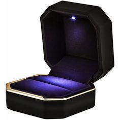 an open black box with purple light inside