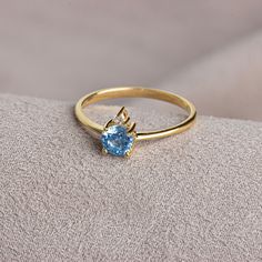 Aquamarine; It is also known as the stone of calmness and courage. The meaning of Aquamarine stone, which has a crystal structure, is sea water. Thanks to its blue color, it resembles streams and seas. Aquamarine is the birthstone for those born in March. Meet the essence of elegance: Solitaire aqumarine ring. Handcrafted with precision, this exquisite piece features a majestic sapphire set in a magnificent design. A symbol of timeless beauty, it embodies sophistication and elegance. Elevate you 14k Gold Gemstone Birthstone Ring, Gold Topaz Birthstone Ring In Sterling Silver, Luxury Birthstone Ring With Center Stone As Gift, Yellow Gold Topaz Birthstone Ring For Gift, Yellow Gold Topaz Birthstone Ring As Gift, Fine Jewelry White Gold Topaz Birthstone Ring, Gold Topaz Solitaire Jewelry, Gold Blue Topaz Ring For Gift, 14k Gold Round Cut Birthstone Wedding Ring