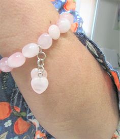 A Soothing and Comforting Stretch Bracelet to wear every time !  Rose Quartz  the Universal Stone of Love in a pretty bracelet with hearts Rose quartz charms.   measures:   7 - 7.1/2  inches.  (Expands to fit larger hands and wrists)  Each nugget is approx. 1/2 inch.  Pretty, romantic gift for that special lady. Pink Heart-shaped Spiritual Beaded Bracelets, Pink Natural Stone Bracelets For Friendship, Pink Natural Stones Bracelet For Friendship, Pink Natural Stones Jewelry For Friendship, Pink Spiritual Bracelets For Valentine's Day, Pink Rose Quartz Bracelets For Valentine's Day, Valentine's Day Pink Rose Quartz Bracelets, Pink Spiritual Charm Bracelet For Friendship, Adjustable Heart-shaped Pink Crystal Bracelet