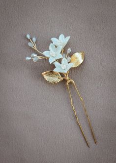 Indulge in the beauty of wild flowers with our Wildflower something blue bridal hair pin that celebrates the age old tradition. Let the delicate details and organic design transport you to a blooming meadow of wild flowers, where beauty, simplicity and the romance of nature intertwine. Like a little bouquet of flowers in your hair, this hair pin is a perfect accompaniment to romantic bridal hairstyles and bridal aesthetics. * DETAILS * > Designed and handmade in Australia. Worldwide shipping > Handcrafted from tarnish resistant jewellery wire > Featuring handcrafted clay flowers, faceted crystal beads, Czech seed beads > Individual hair pin > Colours: Gold or silver with blue or ivory details * MADE TO ORDER * The Wildflower hair pin is made to order. Please allow 2 for production plus del Blue Hair Pins, Blue Hair Accessories, Bridal Hair Pin, Something Blue Bridal, Gift For Bride, Ribbon Wrap, Blue Bridal, Hair Accessories Gift, Bridal Hair Pins